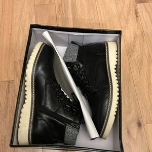 Men’s Steve Madden black boots with tan soles